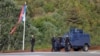 Косовскиполицајци патролираат по патот до манастирот Бањска во близина на Звечан, Косово, 26 септември, 2023