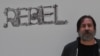 Dan Perjovschi, artist român, ilustrator și scriitor, contestă paternitatea unei opere puse pe piața de artă. 