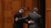 Marcel Ciolacu și Nicolae Ciucă pleacă de la ședința comună solemnă a Senatului şi Camerei Deputaţilor consacrată comemorării a 35 de ani de la Revolta Anticomunistă de la Braşov din 15 noiembrie 1987, organizată la Palatul Parlamentului din București, 14 noiembrie 2022. 