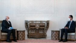 иранскиот министер за надворешни работи Мохамед Џавад Зариф и сирискиот претседател Башар ал Асад