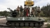Militari ucraineni la intrarea în orașul Izium din regiunea Harkov, 17 septembrie 2022