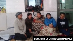 Women whose families face eviction from their houses hold a protest action in front of the government office in Astana on July 27.