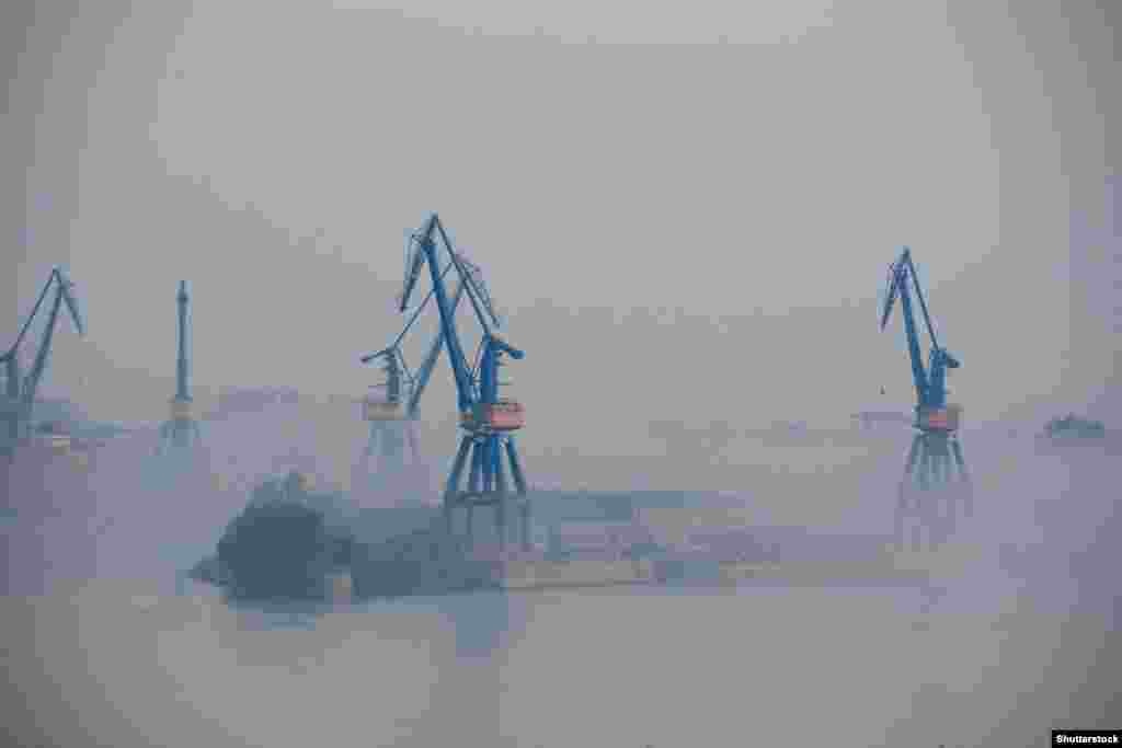 Port cranes at Tulcea, near where the Sulina Canal meets the Danube River The limited capabilities of Romanian ports has resulted in a huge buildup of both ships, trucks, and trains, which queue on Ukraine&#39;s borders to export grain. Ukraine&#39;s railway lines are wider than most of the rest of Europe, resulting in sluggish transport speeds from the country&#39;s western border.&nbsp;