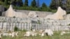 Bosnia and Herzegovina, Mostar, Gathering of citizens at the devastated Partisan Memorial Cemetery, June 16, 2022