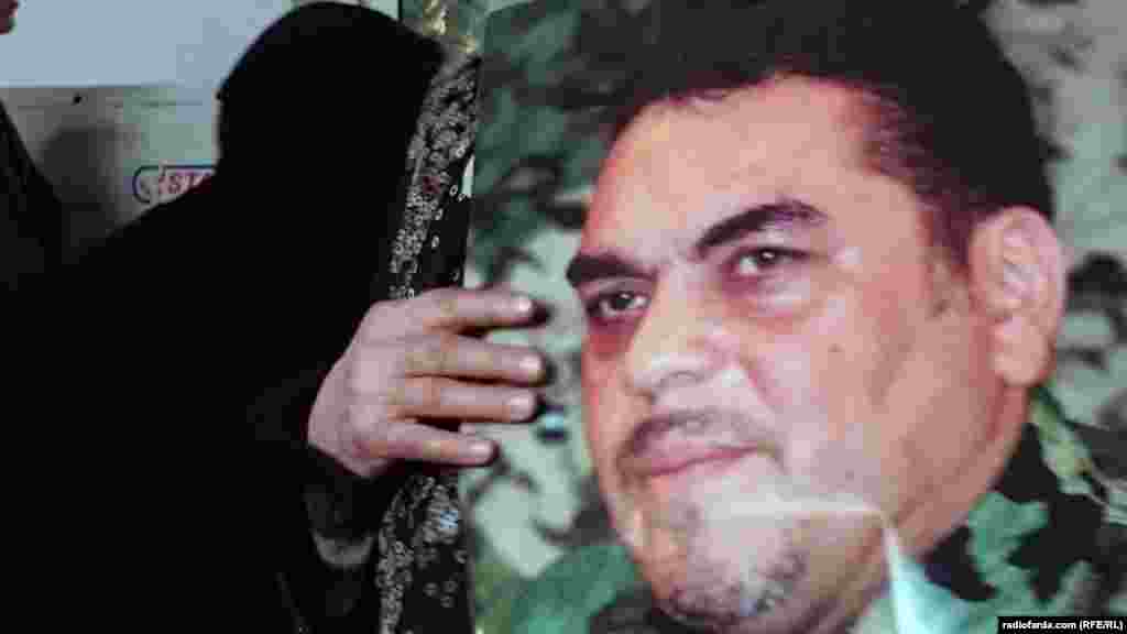 A mourner holds a photo of Samir Kantar, a senior Hizballah militant, at his funeral in Beirut on December 21.