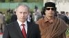 Российский президент Владимир Путин и ливийский лидер Муамар Каддафи (слева направо) во время встречи в государственной резиденции "Азизия". Фото ИТАР-ТАСС/ Михаил Климентьев, 16 апреля 2008