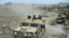 Afghan security forces patrol during an ongoing an operation against Islamic State (IS) militants in Kot district of Nangarhar Province on February 16.
