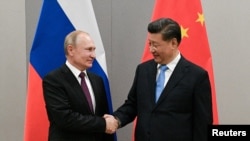 претседателите на Русија и Кина Владимир Путин и Си Џинпинг (фотографија од датотека)