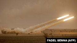 Lansator american de rachete cu mobilitate înaltă (HIMARS) la manevrele militare „African Lion" din regiunea Grier Labouihi, sudestul Marocului, 9 iunie 2021 