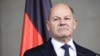 German Chancellor Scholz talks to reporters after confidence vote request submitted in Berlin