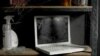  Useless laptop forgotten on a dusty shelf in the garage 