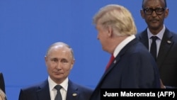 Президент США Дональд Трамп и президент России Владимира Путина на саммите G20, ноябрь 2018 года