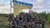 Militari ucraineni la intrarea în localitatea Șevcenkove, recent eliberată, în regiunea Harkov, Ucraina, 10 septembrie 2022