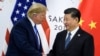 Në këtë foto të realizuar më 28 qershor 2019, Presidenti i Kinës, Xi Jinping, shtrëngon duart me Presidentin amerikan, Donald Trump, gjatë një takimi dypalësh në kuadër të Samitit të G20 në Osaka.