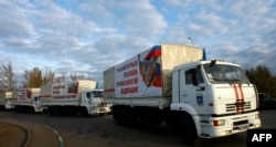 Russian trucks cross the Ukrainian border at the Donetsk-Izvarino customs checkpoint in late October.