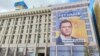 Një pano me fotografinë e Yehen Murayevit e vendosur në Kiev. Britania tha se Rusia dëshiron që Murayev të udhëheqë Qeverinë ukrainase, pretendime këto që janë hedhur poshtë nga vetë Murayevi dhe Moska. 