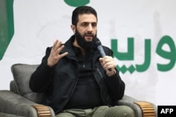 Jolani gjatë një konference për media në Bab al-Hava të Sirisë më 12 mars 2024.