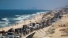Displaced Palestinians move southward after Israeli forces ordered residents of Gaza City to evacuate to the south