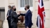 British Foreign Secretary Dominic Raab (right) greets U.S. Secretary of State Antony Blinken at Carlton Gardens for talks in London on May 3.
