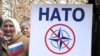 Учасники мітингу проти НАТО