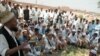 A Pashtun tribal leader addressing a jirga near the Khyber Pass.
