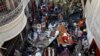 Rescue workers gather at the site of a passenger plane crash in a residential area near an airport in Karachi on May 22.
