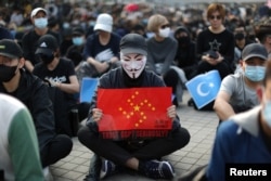 Imagine de la proteste din Hong Kong față de torturarea uigurilor de către China