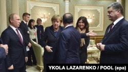 Președintele rus Vladimir Putin, cancelara germană Angela Merkel, președintele francez Francois Hollande și președintele ucrainean Petro Poroșenko la primele negocieri privind criza ucraineană, Minsk, Belarus, 11 februarie 2015.