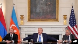U.S. - President Donald Trump, joined by Armenian Prime Minister Nikol Pashinin and Azerbaijan President Ilham Aliyev, speaks during a trilateral signing ceremony at the White House, August 8, 2025. 