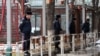 Armenia - Police officers guard kiosks built in Yerevan's Mashtots Park, 13Mar2012.