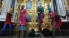 Участницы феминистской панк-группы Pussy Riot во время нелегального выступления в Храме Христа Спасителя. Фото ИТАР-ТАСС/ Митя Алешковский