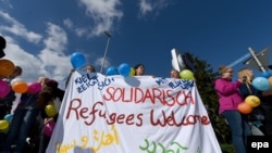 Locuitorii din Kiel se declară solidari cu refugiații care fuseseră aduși în oraș, 2 septembrie 2015. 