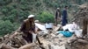 Afghans search remnants of damaged houses, after earthquakes at Nurgal district in Kunar province, in Eastern Afghanistan, on September 4, 2025.
