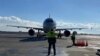 Armenia - Marshallers guide a plane that landed at Zvartnots international airport, Yerevan, January 15, 2021.