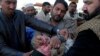 A health worker gives a polio vaccine to an Afghan refugee child in Peshawar (file photo).