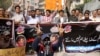 FILE: Pakistani journalists shout slogans during a protest against the alleged killing of a journalist Aziz Memon in the southern city of Hayderabad in February