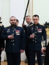 Президент России Владимир Путин с награжденными медалью "Золотая Звезда" и получившими звания "Героев России" за участие в войне против Украины офицерами Минобороны и Росгвардии в День защитника Отечества в Кремле. Москва, 23 февраля 2025 года